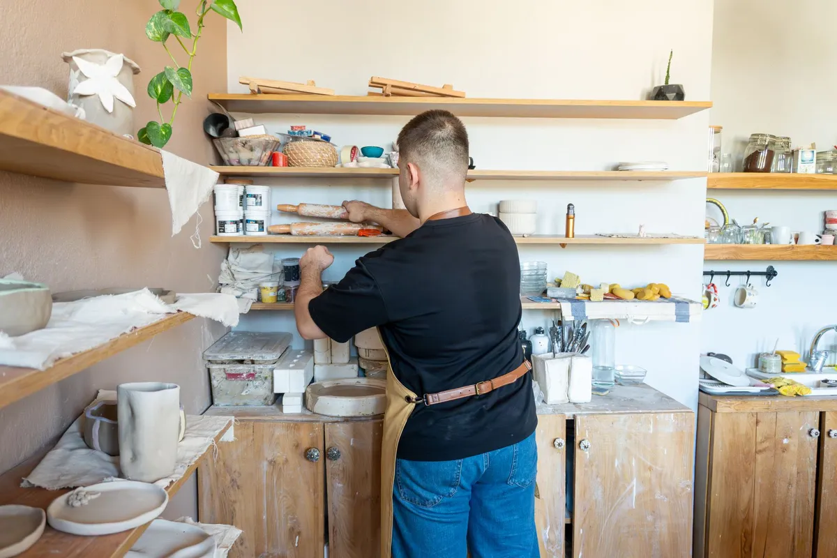 Small ceramics studio with pottery shelves